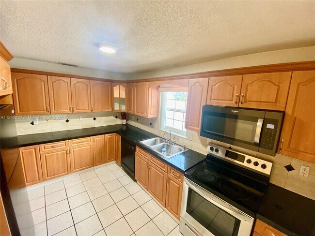 Building Photo - 3024 N 73rd Ter