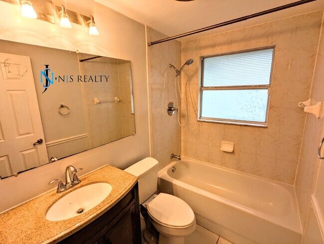 Building Photo - REDUCED!! NEW FLOORS, NEW PAINT INSIDE & OUT.. 2/1/1 with a bonus room! just minutes from downtow...