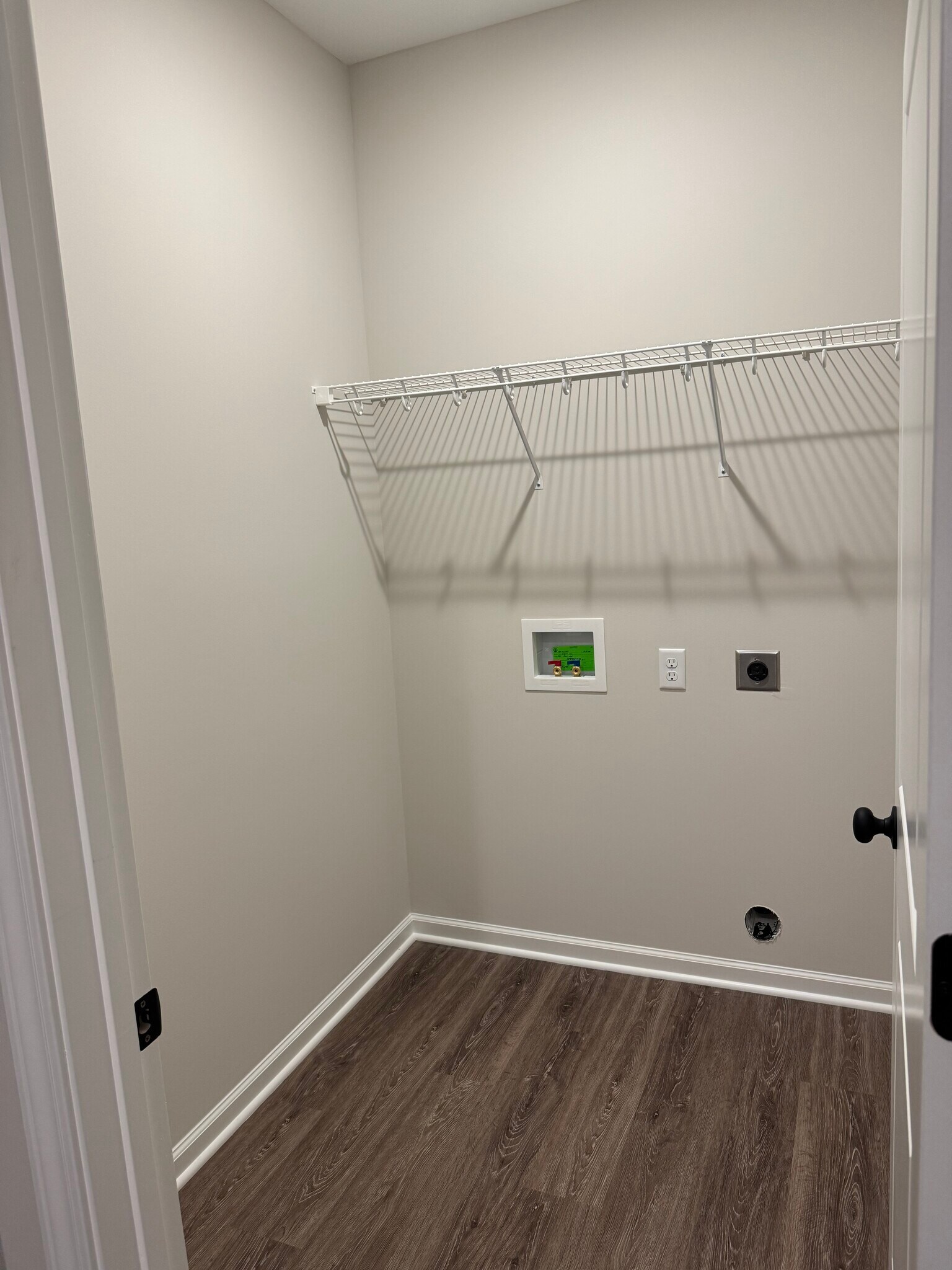 Dedicated laundry room—washer and dryer included (not shown in photo). - 205 Cherry Way