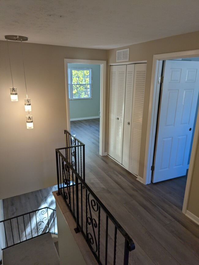 Upstairs hallway with linen closet - 9 Willowick Dr