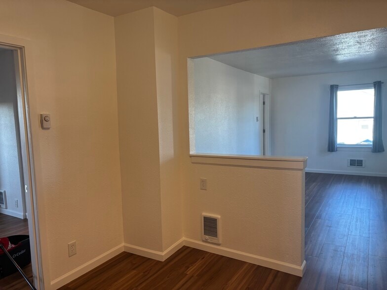 Kitchen eating area to living room. 1st bedroom is left. - 1725 S 35th St