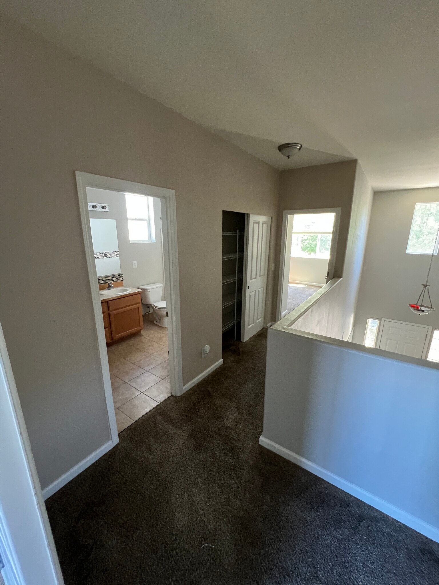Hallways to guest bathroom and other bedrooms - 3601 Lanyard Dr NE