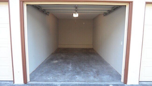 Building Photo - REMODELED 2BR; 1BA end unit condo w/ 1 car garage & 1 parking space