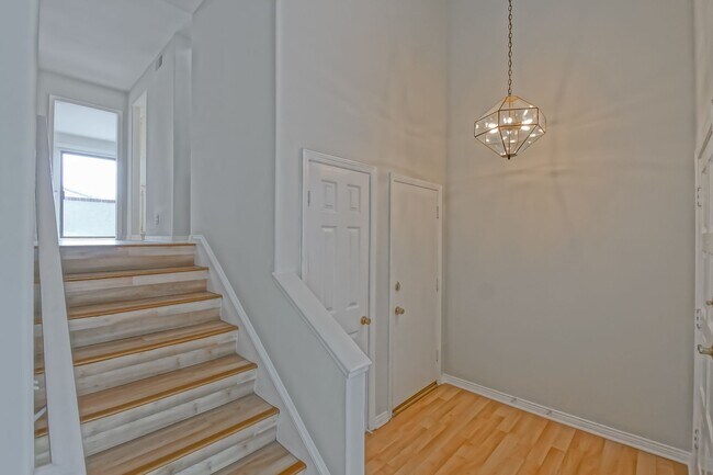 Building Photo - PRIME POOLFRONT LOCATION & CLOSE TO MAIN GATE! BRIGHT & SPACIOUS, END-UNIT POOLFRONT TOWNHOUSE W/...