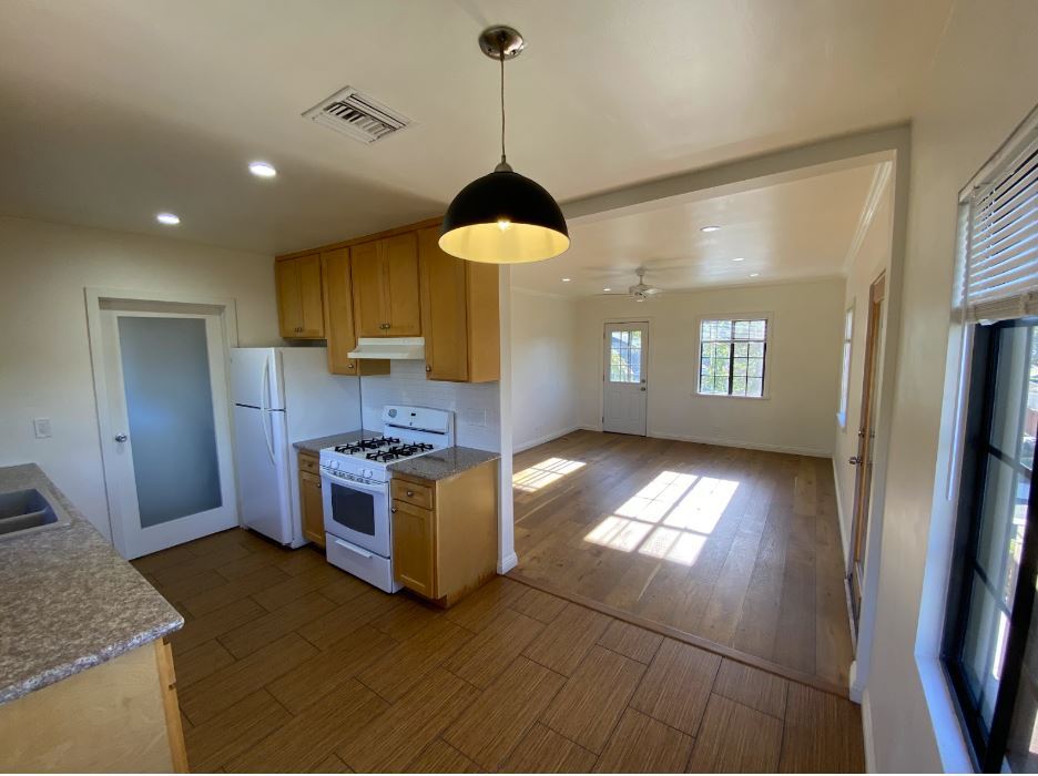 Frosted door in the kitchen leads to the laundry room. - 1733 Phillips Way