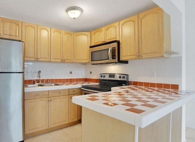 Building Photo - 4275 NW S Tamiami Canal Dr