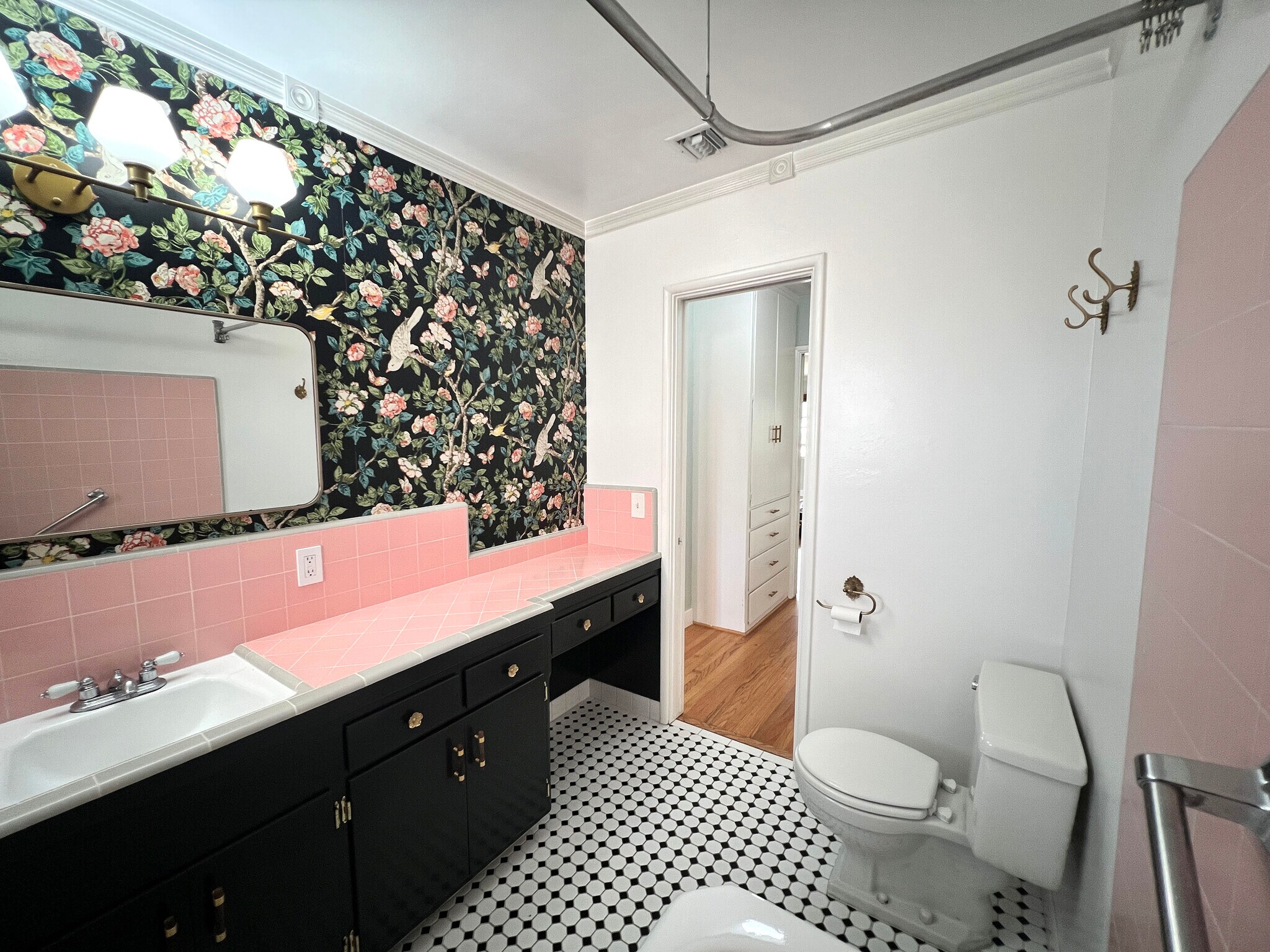Pink tile bathroom with floral wallpaper. - 1327 N Central Ave