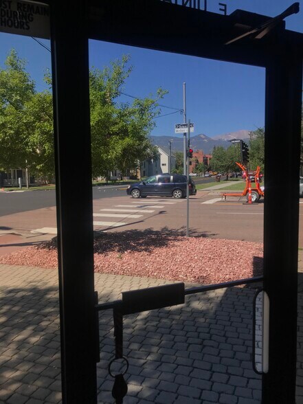 Front glass door with view of Pikes Peak - 302 E Uintah St