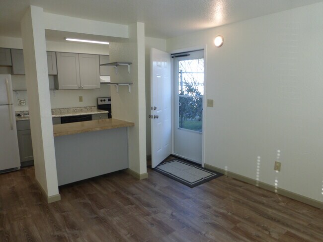 Open concept living room and kitchen with new cabinet - 215 8th St SE