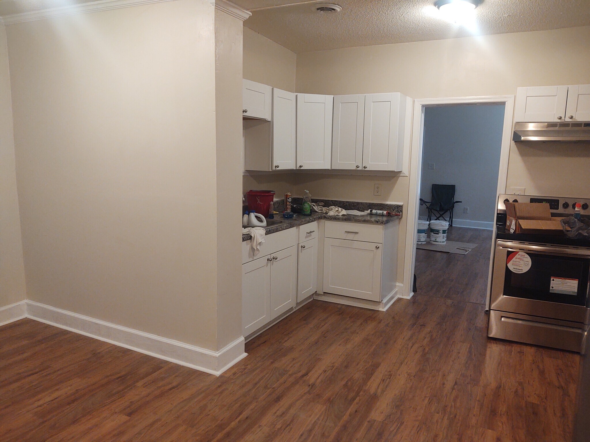 One half of kitchen, living room entrance - 116 Houseworth St
