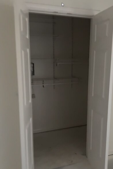 Another look at the roomy closet complete with hanging racks. - 4720 Burma Rd