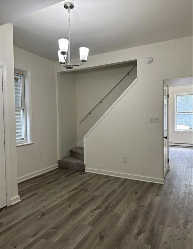 Dining room with closet and stairs to upstairs - 1209 Mechanic St