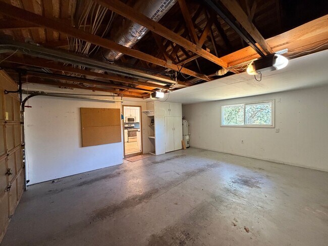 Building Photo - Spacious 4BR/3BA Home with Deck, Fenced Yard & Garage