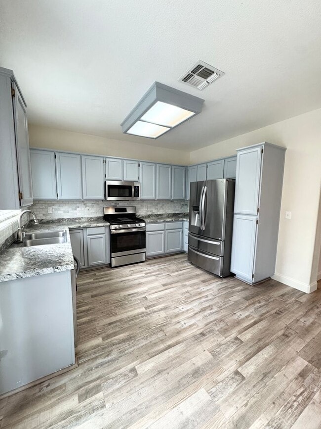 Building Photo - Spacious Solar-Powered 4-Bedroom, 3-Bath Home with Vaulted Ceilings & Tons of Storage! SEE VIDEO