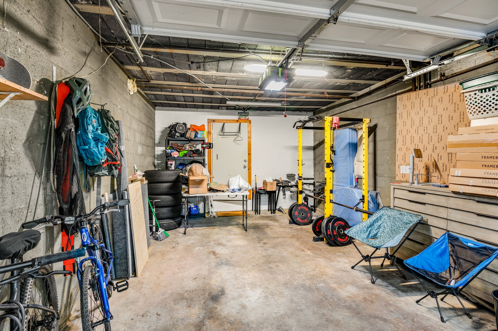 1 car garage with high ceilings and the door in the rear leads to a storage room - 96 Ardmore Pl NW