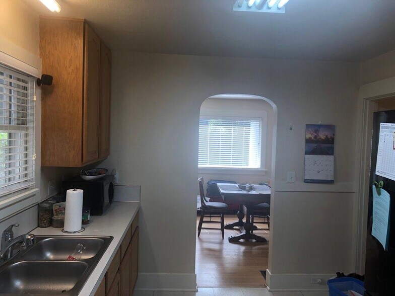 View from kitchen to living room on side with FP - 8528 SW 35th Ave