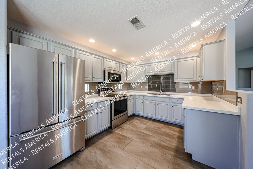 Building Photo - 9555 E Raintree Dr