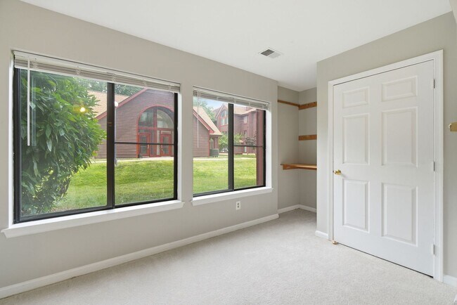 Building Photo - Contemporary design meets exceptional space in this inviting ground level residence, offering eff...