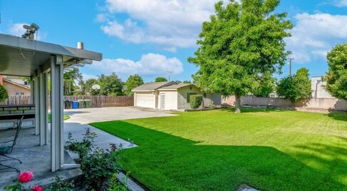 Backyard has a garage attached to a backhouse - 1419 S 4th Ave
