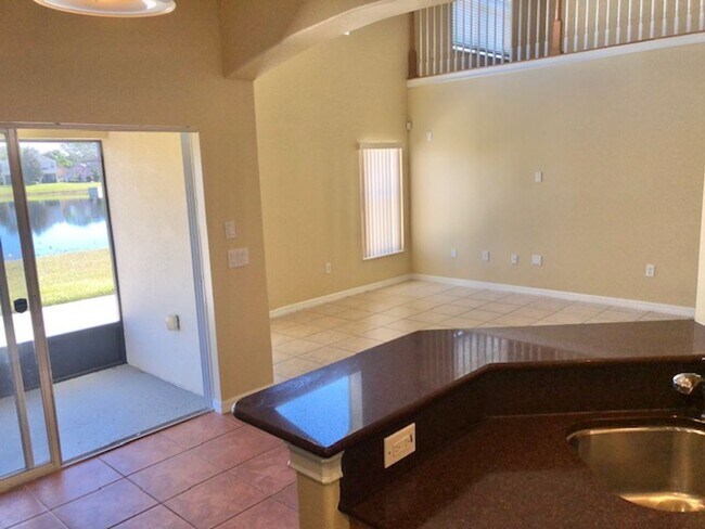 Building Photo - EAGLE CREEK LAKE NONA! WELCOME HOME! Beautiful water views! Spacious 2 story-3 bedroom 2.5 bath h...