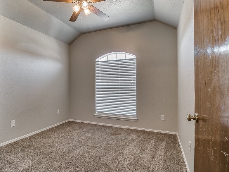Bedroom 2 with large window looking into the front yard - 1821 Overland Trail