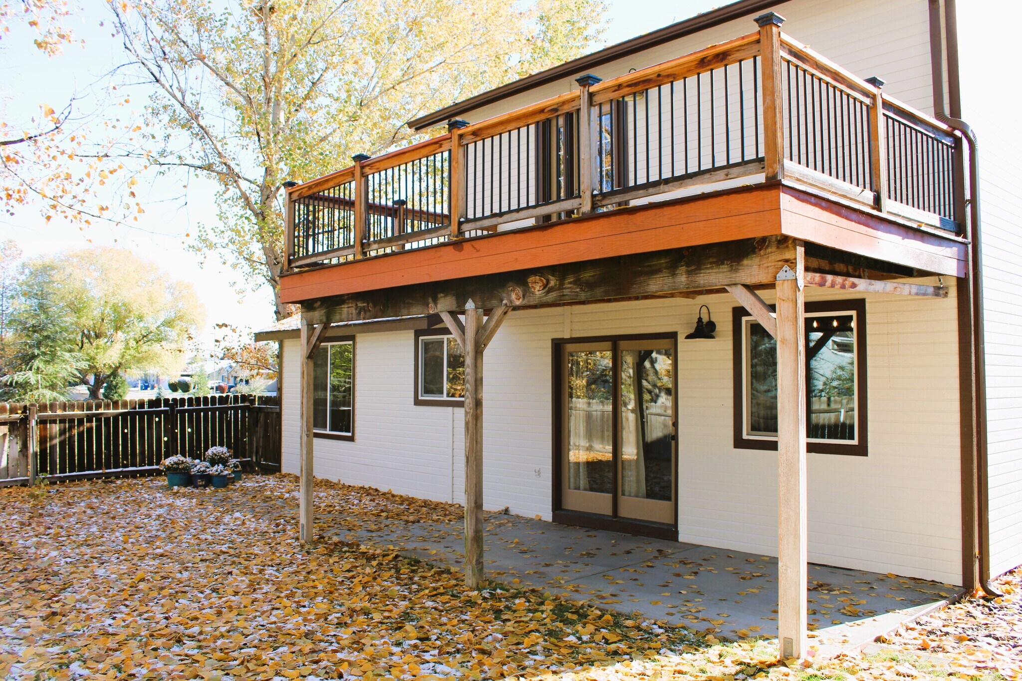 Fenced backyard, patio and upper deck - 11380 W Montana St