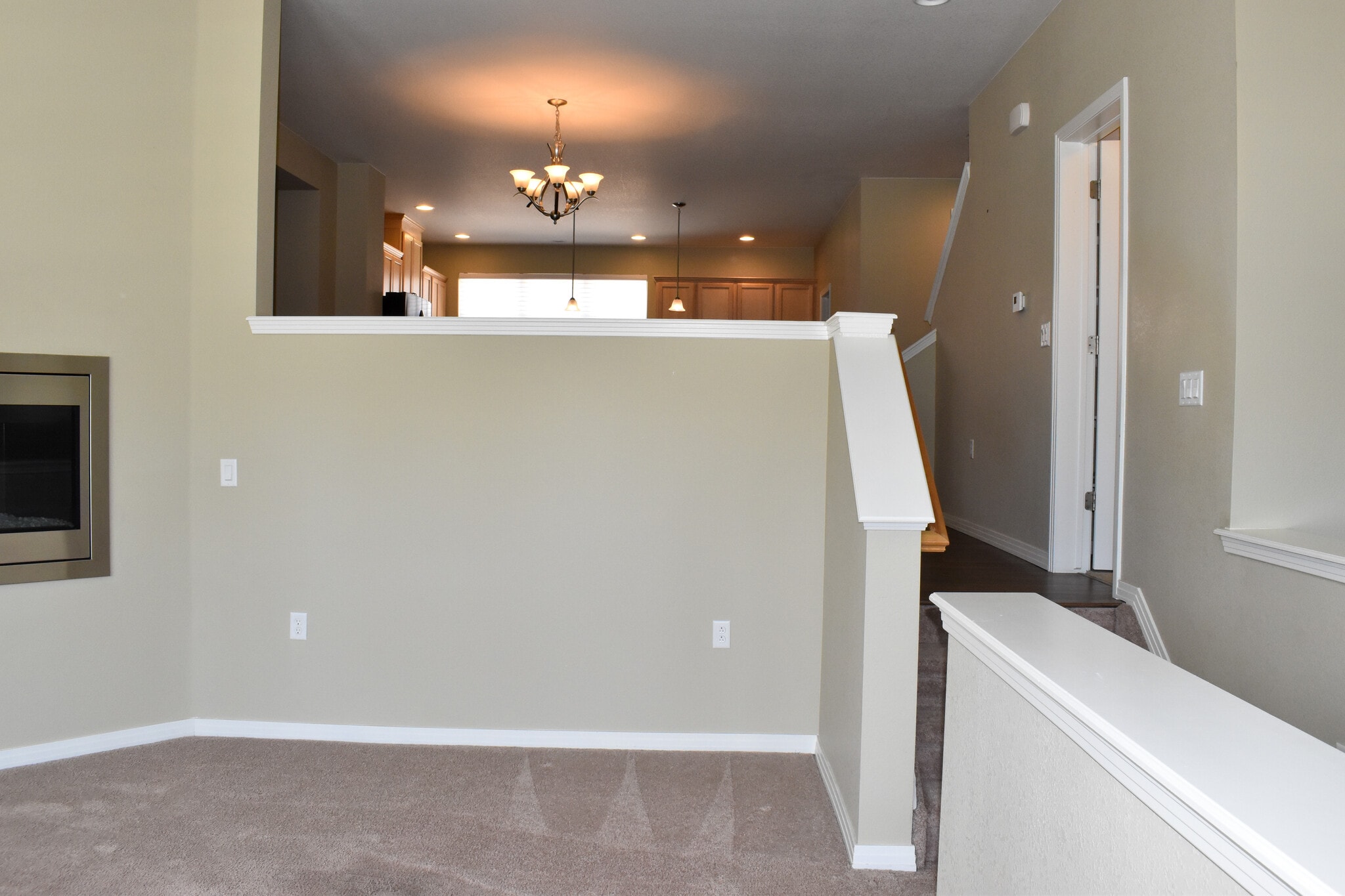 Family Room gas log fireplace with half wall open to dining room and kitchen - 684 Mason St