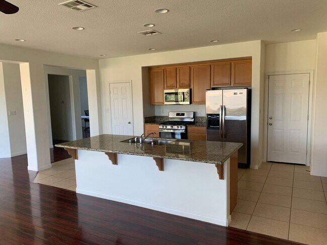 Building Photo - 4 Bedroom Home with Paid Solar, 3-Car Garage & Large Backyard