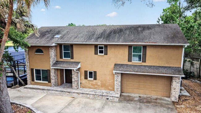 Building Photo - Available Now! Waterfront Living at Its Best – Pool, Decks & Gated Privacy