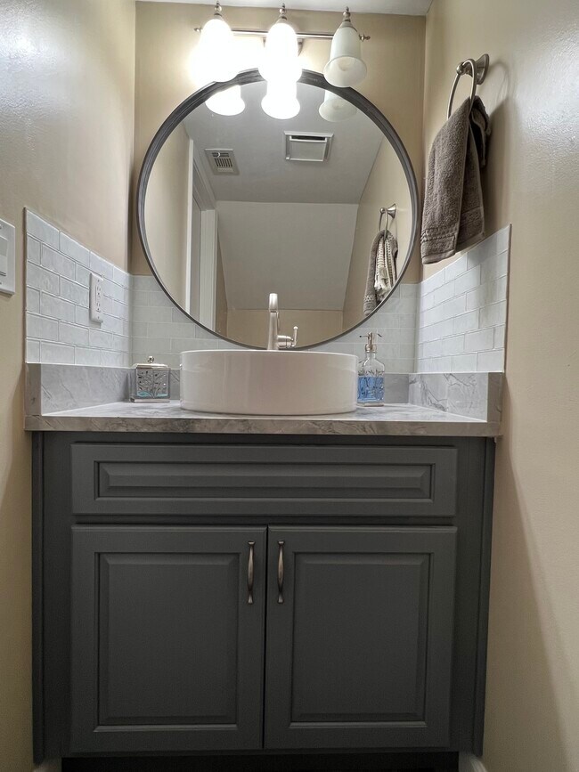 Downstairs 1/2 bathroom. Granite countertop. - 3942 Solano Rd