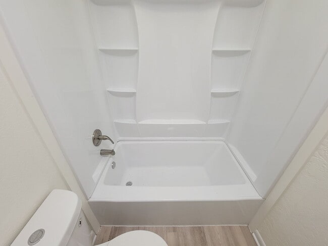 Building Photo - REMODELED 4 BEDROOM 2 BATH LEASE HOME IN A...