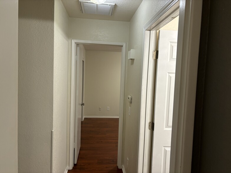 Hallway between bedrooms and bathroom - 445 Almond Dr. #29