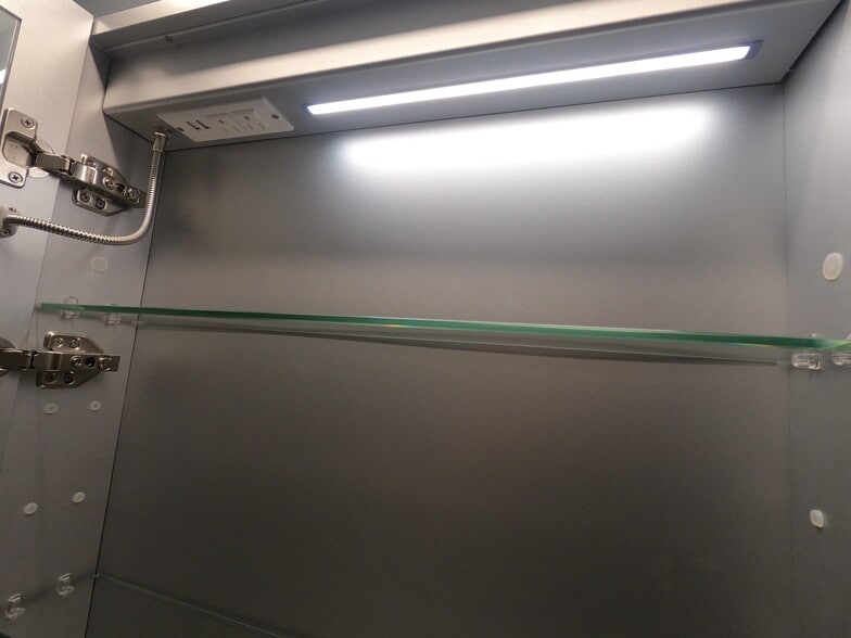 Mirror cabinet includes internal outlet for easy charging of devices while stored - 1714 Fair Acres Ave