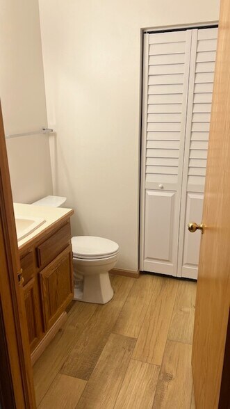 Half bathroom & louver doors to laundry room - 640 Homestead Dr
