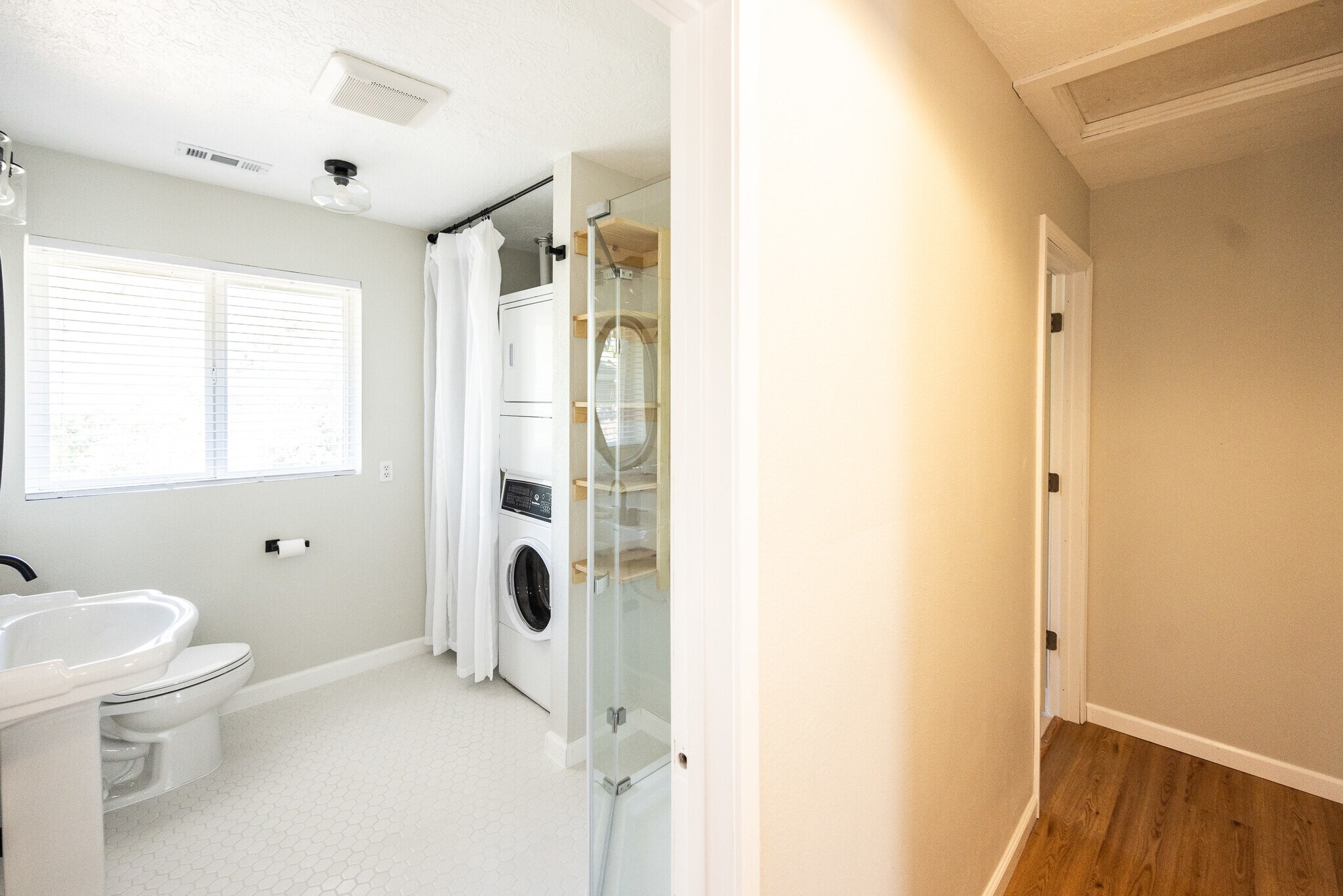 Full bath. First door on left down hallway. - 8717 NE Webster St