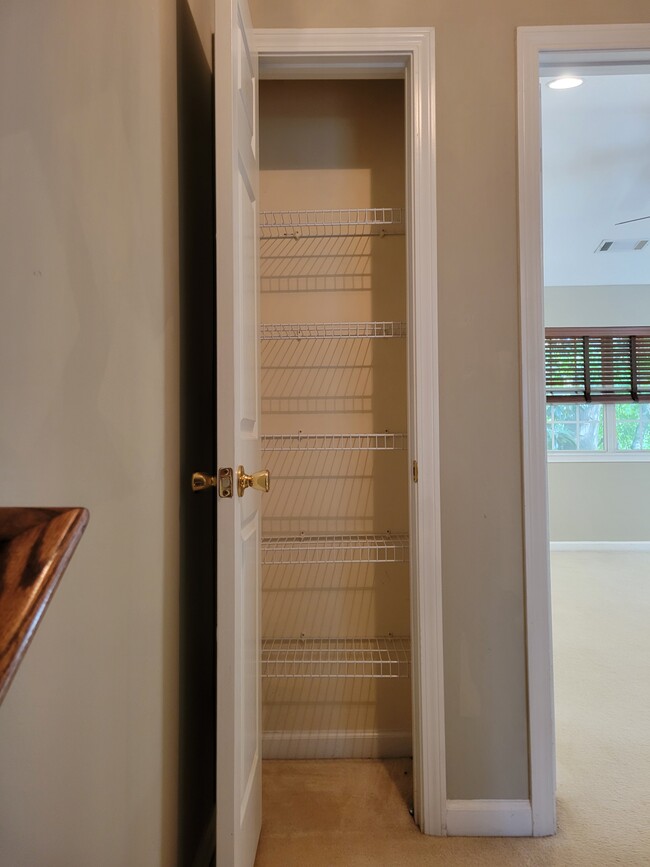 Linen closet at the top of the stairs - 205 Woodstone Dr