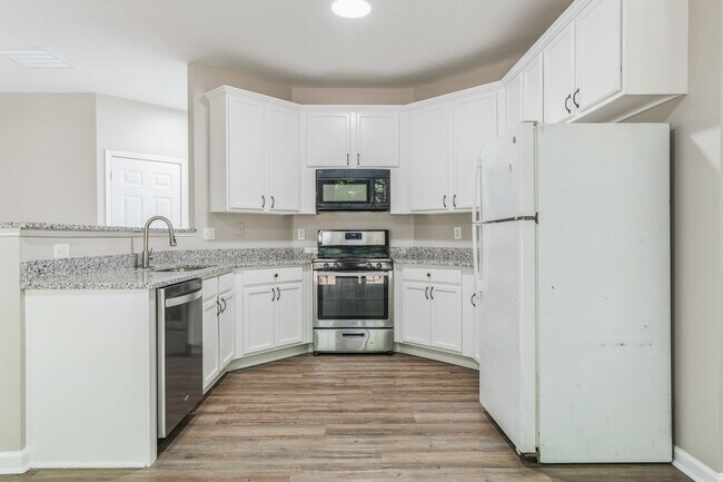 The fridge has been replaced with a large side by side stainless steel fridge. - 2453 Lakebrooke Dr