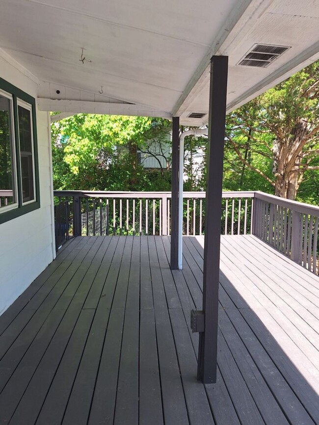 Building Photo - Cute white cottage with white picket fence & Huge deck off back door!