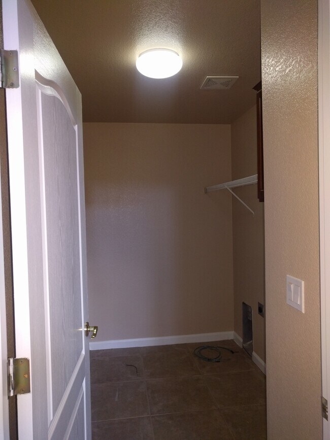 Building Photo - Gated Community Stunner ready to be called...