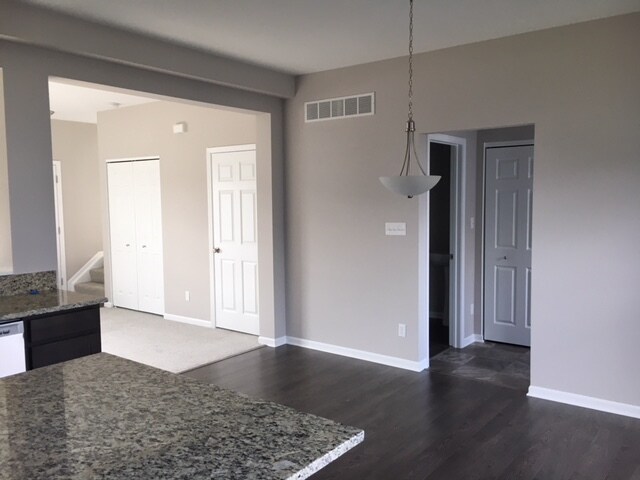 Half bath and laundry room on main floor off of the kitchen. Kitchen opens up to living room. - 2571 W 127th Pl