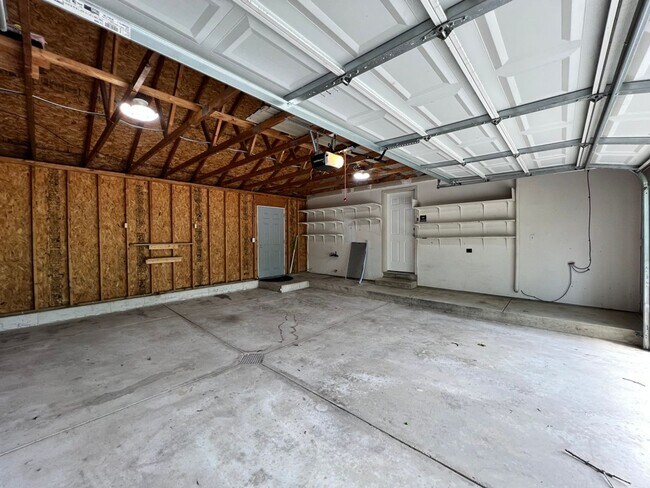 Building Photo - Spacious 3BR Duplex with Finished Basement & 2-Car Garage in Otsego