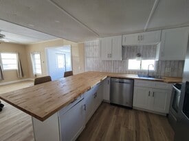 Brand new cabinets and butcher block countertops. - 9065 48th Ave N
