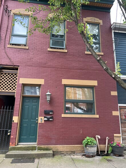Front door and window on quiet street lined with trees and beautiful historic Pittsburgh homes - 1714 Sarah St