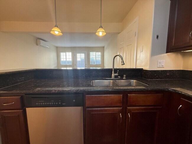 Building Photo - Upgraded Condo with Private Patio, AC, Pool, Gym, and Covered Parking in Gated Community