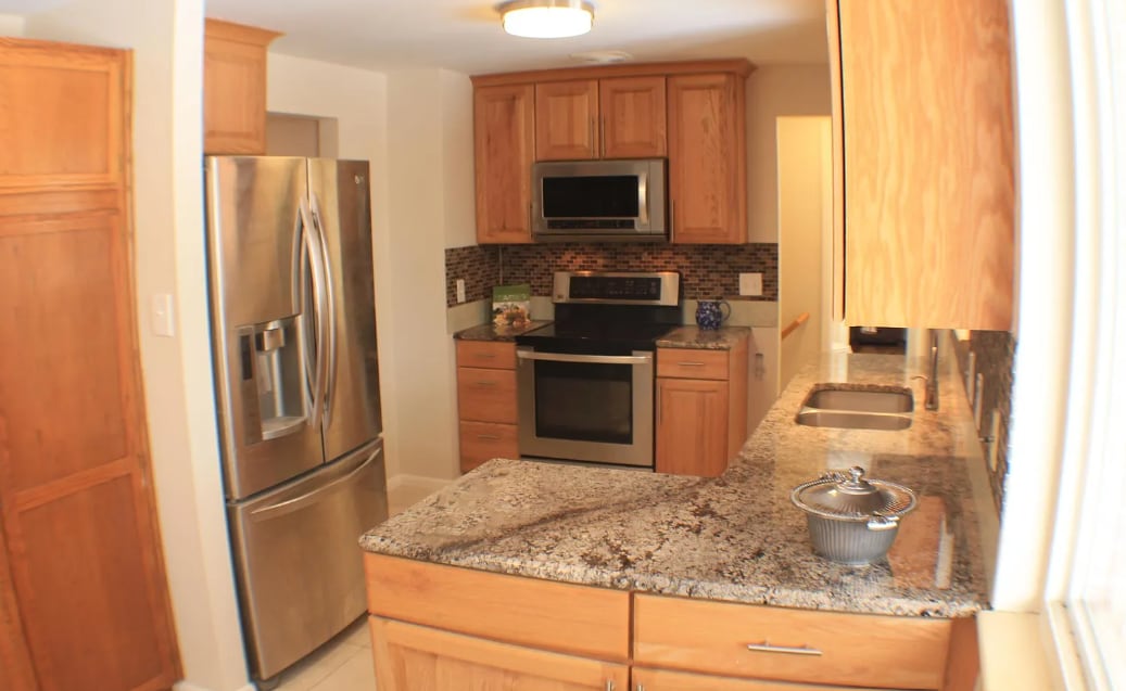 Large kitchen with access to covered porch - 6482 Zephyr St