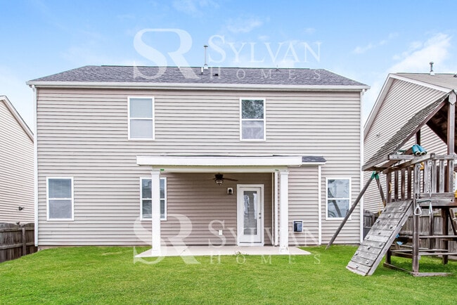 Building Photo - Feel welcome in this well-maintained 4BR 2...