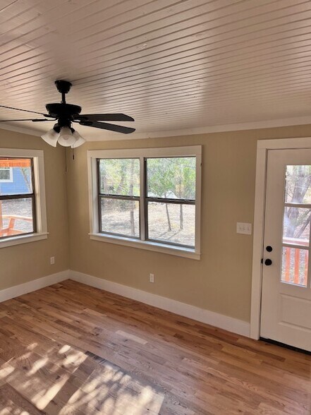 Beautiful view of wooded acreage from living room - 1565 Pump Station Rd