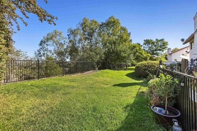 Building Photo - Upgraded La Costa Townhome