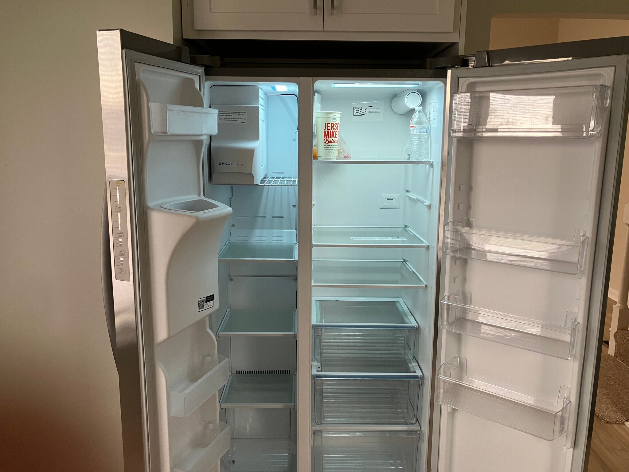 Large frigidaire refrigeratior with ice and water dispenser - 104 E Poplar St