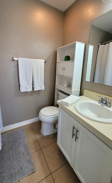 The second bathroom has a tub and a shower. - 4408 Tuscan Loon Dr